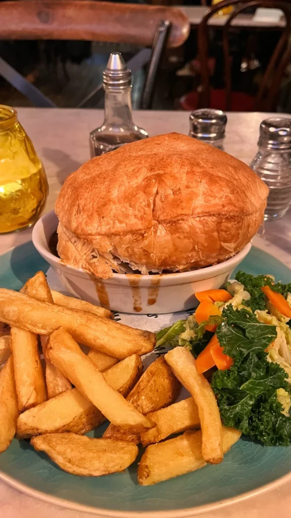 Ma’s Scouse pie served with homemade chips and salad in Liverpool