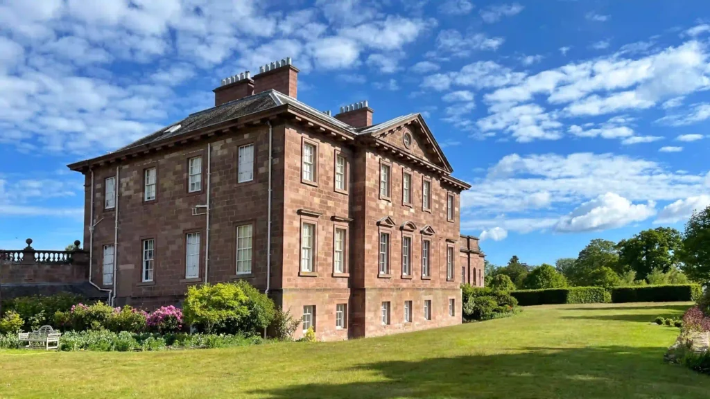 Paxton House and gardens in full sun, surrounded by greenery