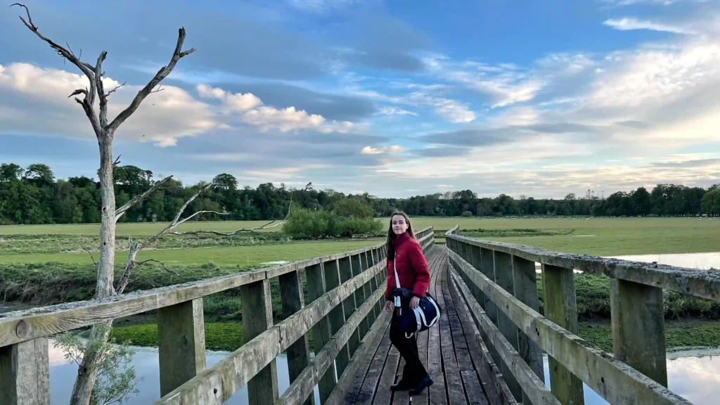Ever Prel crossing a small countryside bridge over a stream in Northern England.