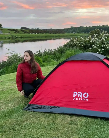 A camp by the River Tweed at sunset