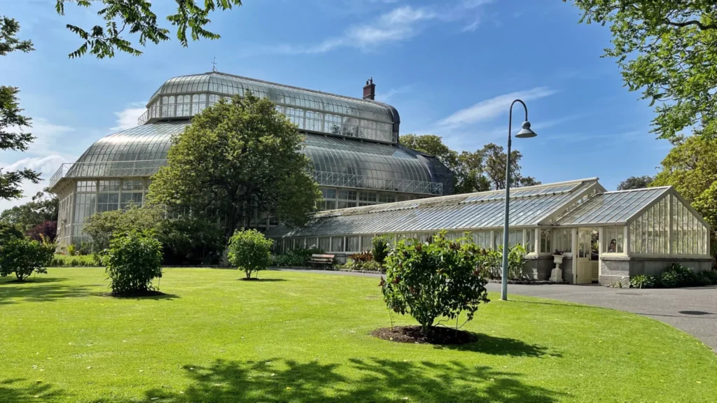 Victorian glasshouse at The National Botanic Gardens in Dublin on a sunny day