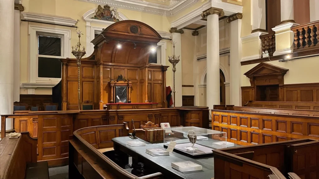 Empty courtroom with yellow walls, National Justice Museum, Nottingham