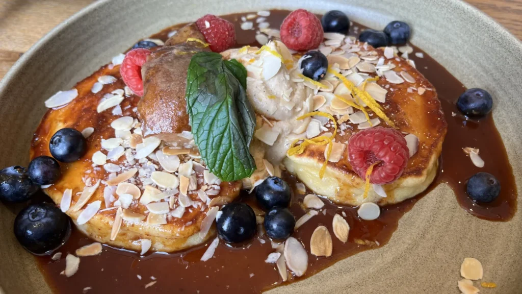 Dulce de leche pancakes at Alma in Portobello, Dublin, topped with fresh berries, mascarpone, almonds and a drizzle of caramel sauce.