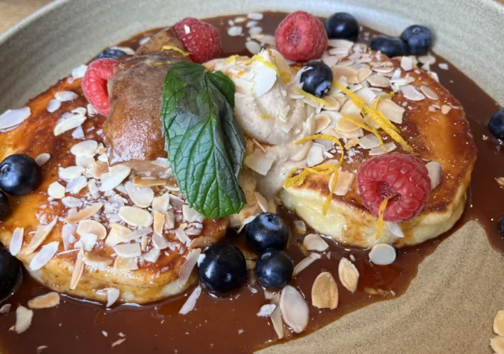 Dulce de leche pancakes at Alma in Portobello, Dublin, topped with fresh berries, mascarpone, almonds and a drizzle of caramel sauce.