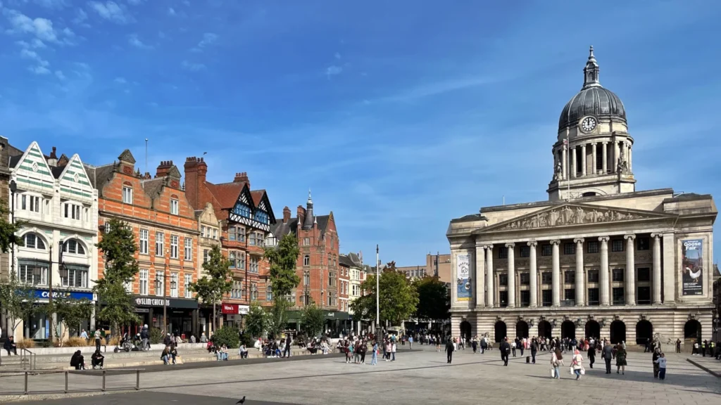 Old Market Square in Nottingham on a sunny day with the Council House and city buildings in the background