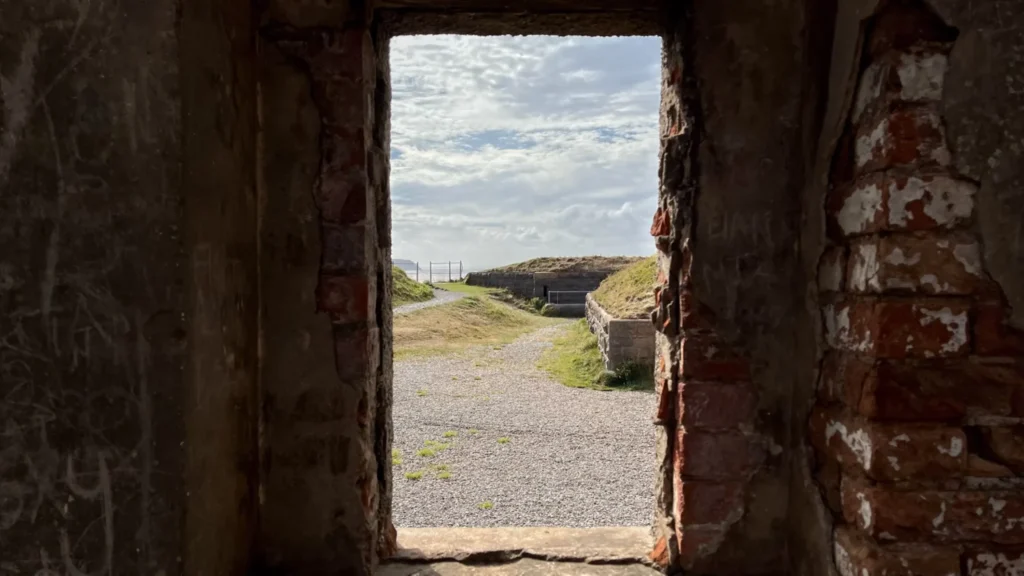 View through a brick doorway at Brean Down Fort looking out towards the old ramparts