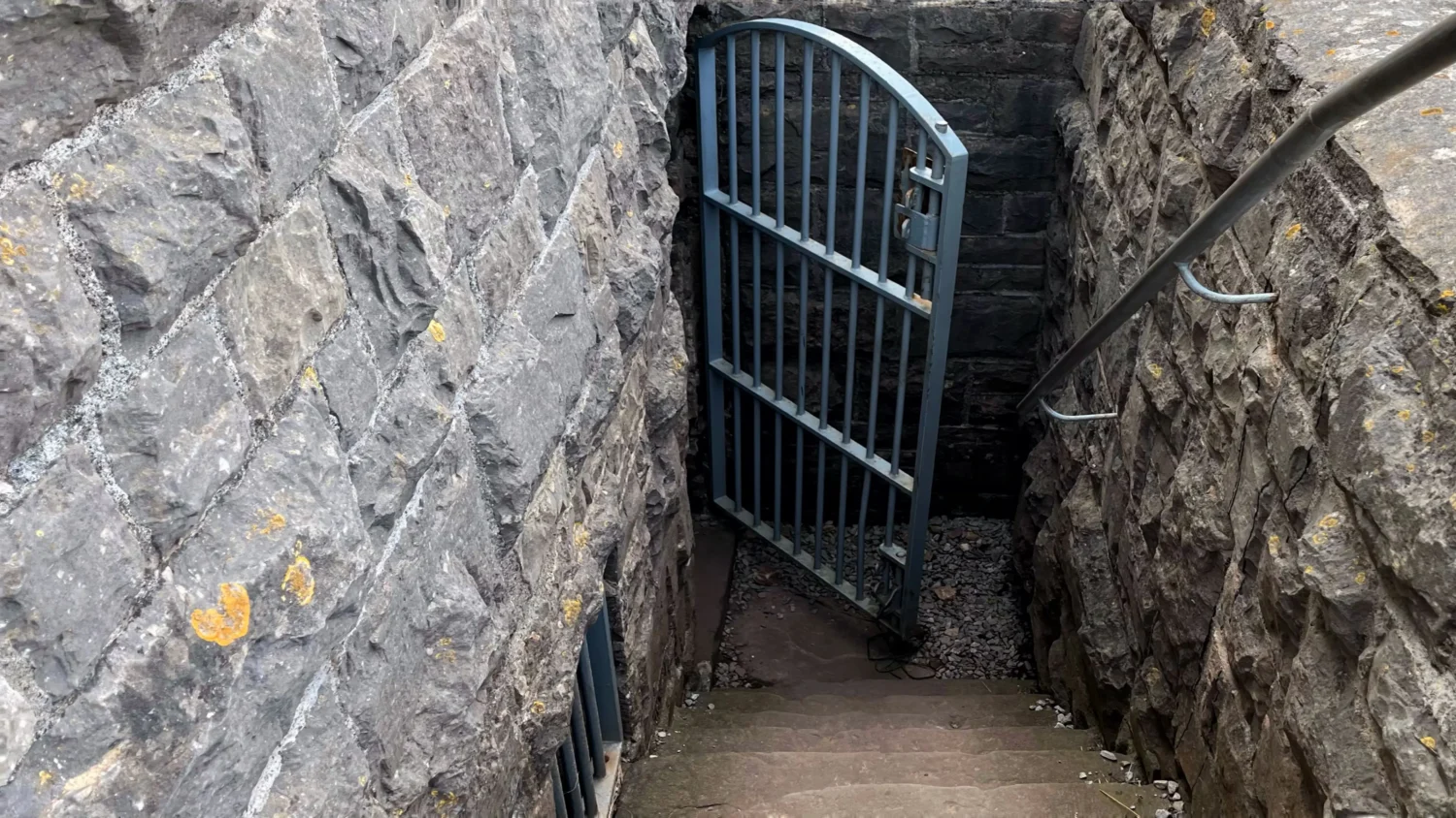 A locked gate and stairway inside the ruins of Brean Down Fort