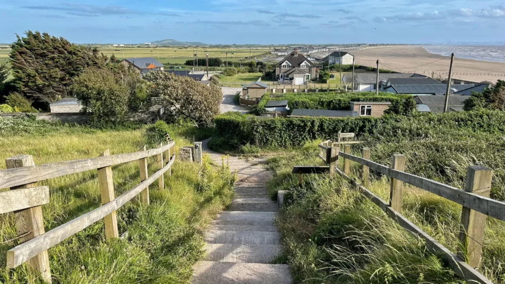 Steps descending from Brean Down toward Brean village, with the beach visible to the right