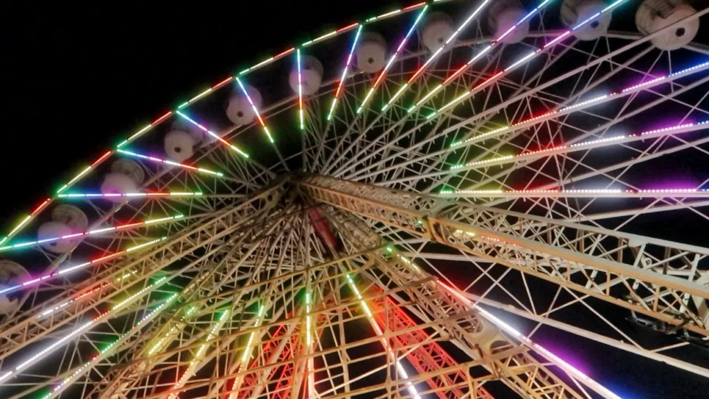 Illuminated Ferris wheel at night on Blackpool Pier, Lancashire