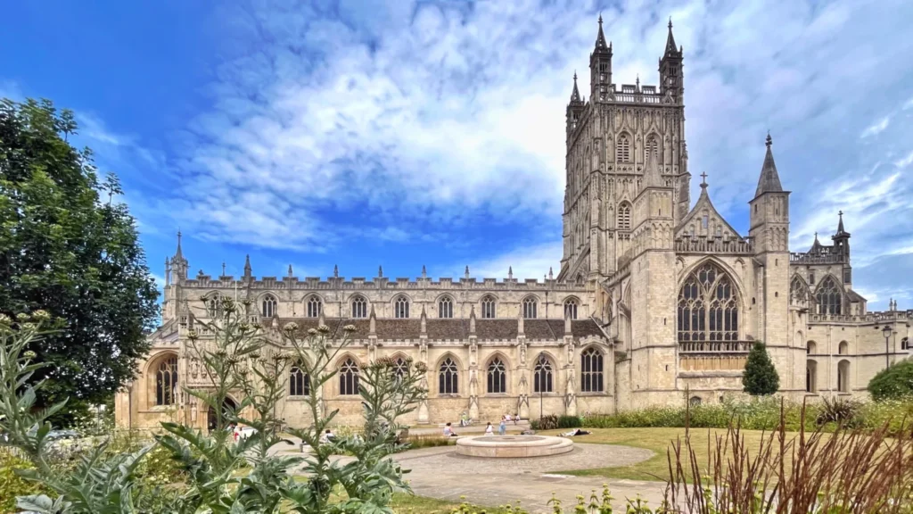 Gloucester Cathedral tower and cloisters seen from the gardens