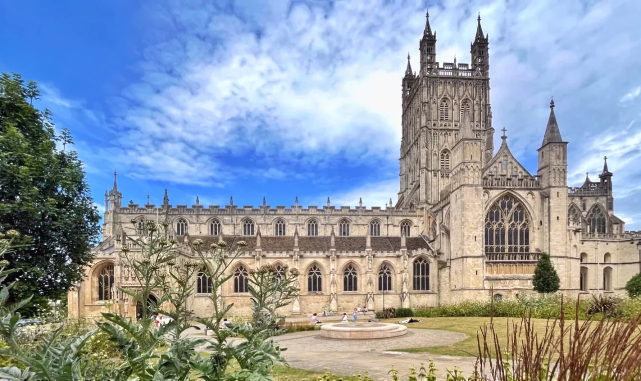 Gloucester Cathedral tower and cloisters seen from the gardens
