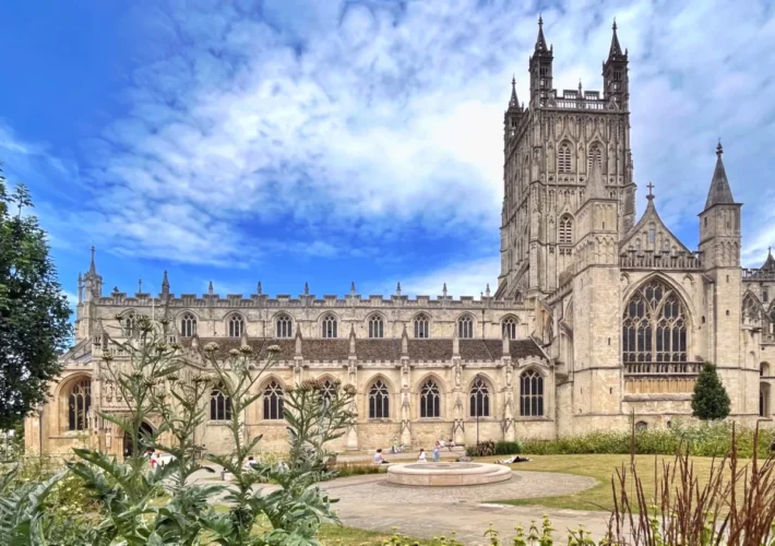 Gloucester Cathedral tower and cloisters seen from the gardens