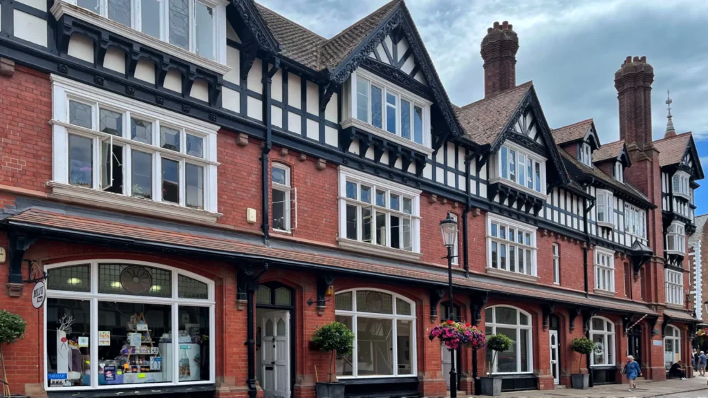 Tudor-style black-and-white timber-framed buildings on a Gloucester street