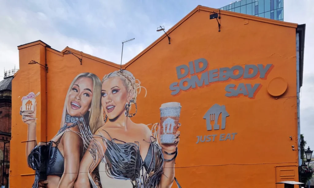 Just Eat mural "Did Somebody Say" featuring Christina Aguilera and Latto on Thomas Street, Northern Quarter, Manchester