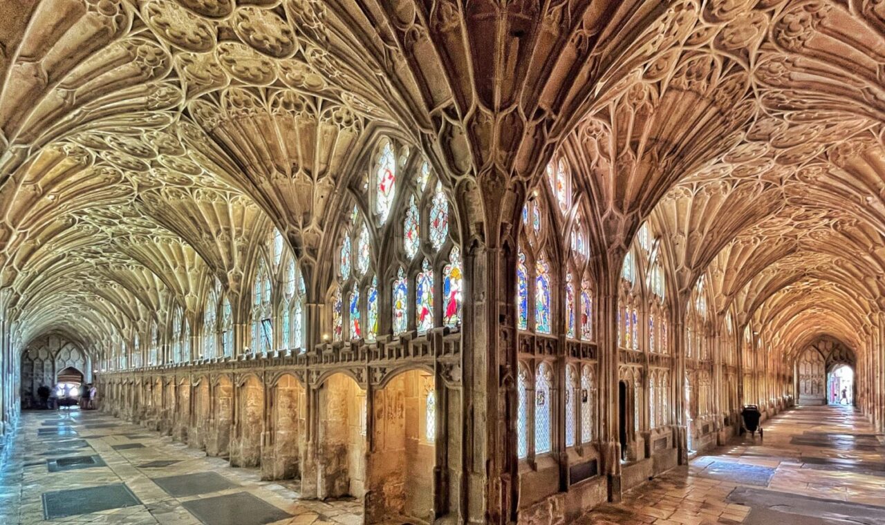The fan-vaulted cloisters at Gloucester Cathedral, looking along two walks from the corner