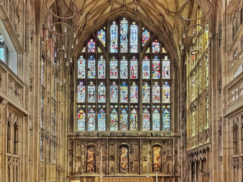 The Lady Chapel at Gloucester Cathedral, fan-vaulted, with its tall east window and carved reredos