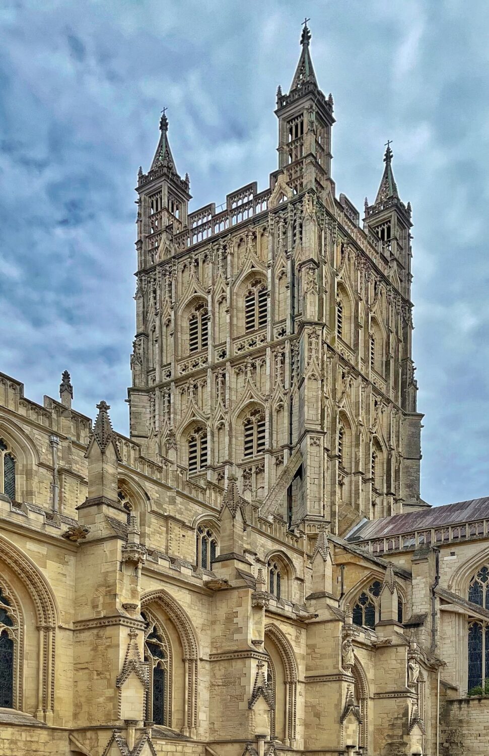 The fifteenth-century tower at Gloucester Cathedral seen from below, with its openwork parapet and pinnacles