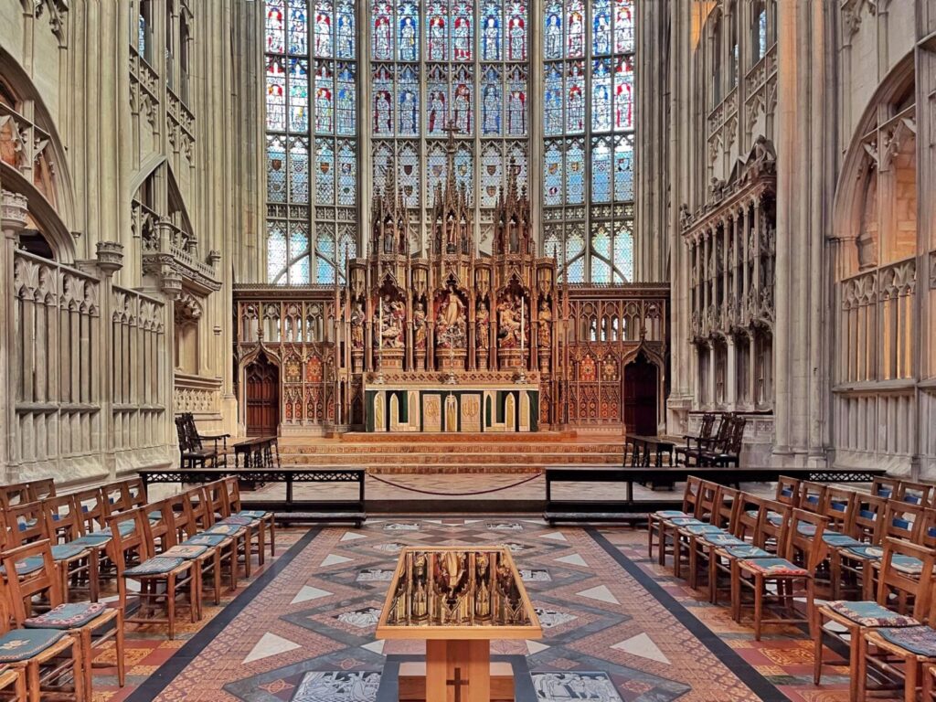 The Great East Window at Gloucester Cathedral seen from the quire, above the high altar and reredos