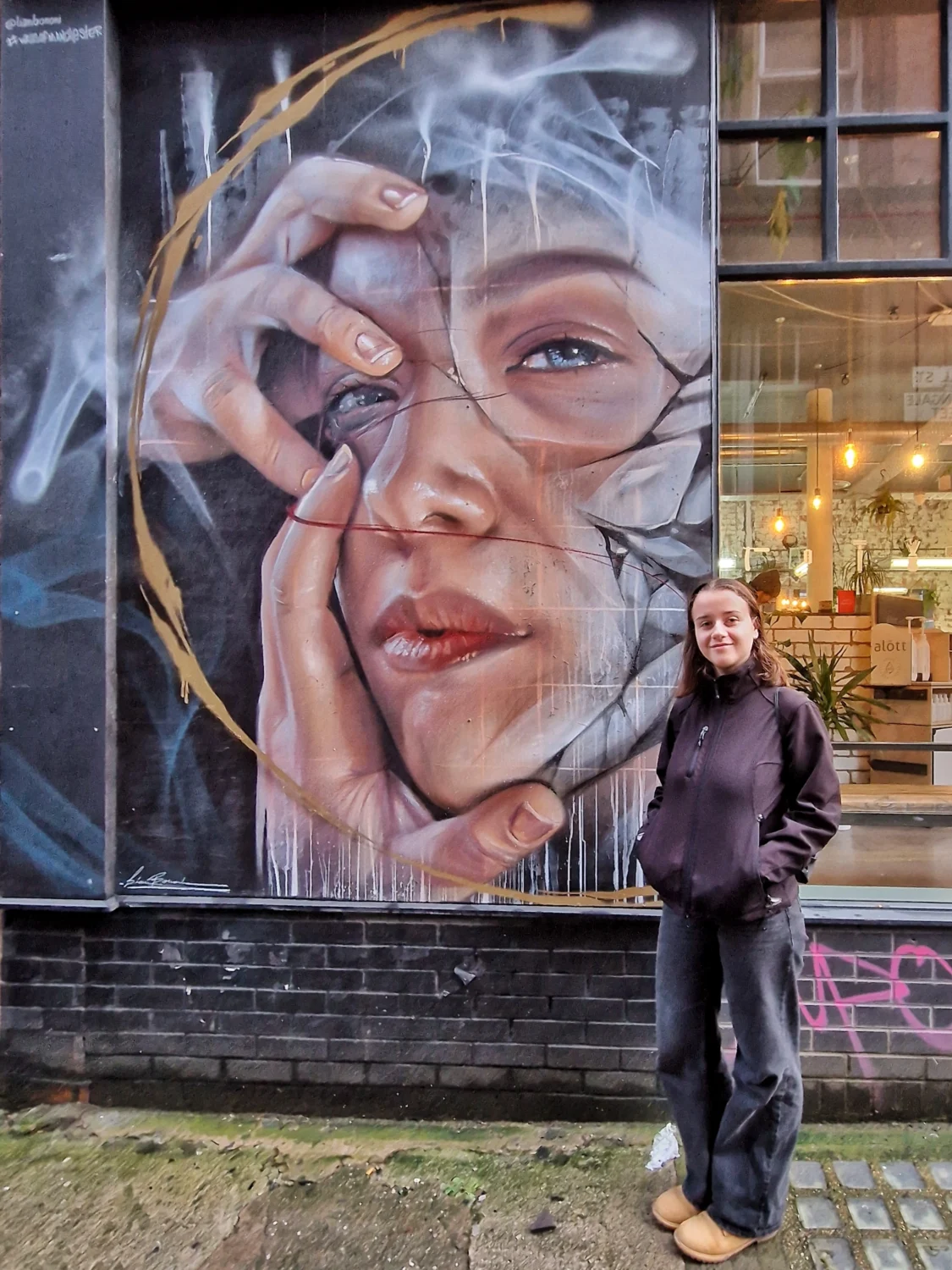 Liam Bononi mural of a cracked glass portrait on Cavell Street, Manchester