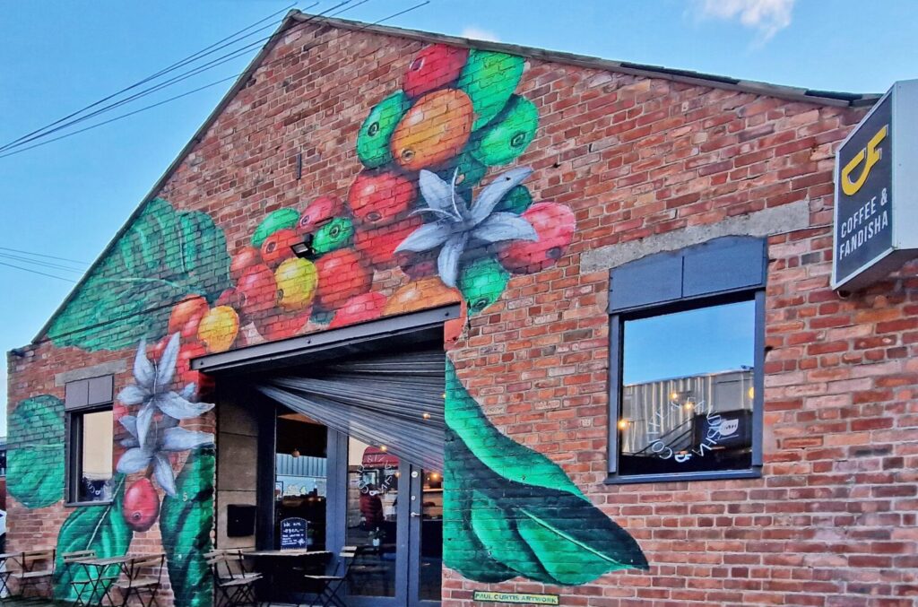 Coffee cherry and blossom mural outside Coffee & Fandisha, Baltic Triangle Liverpool