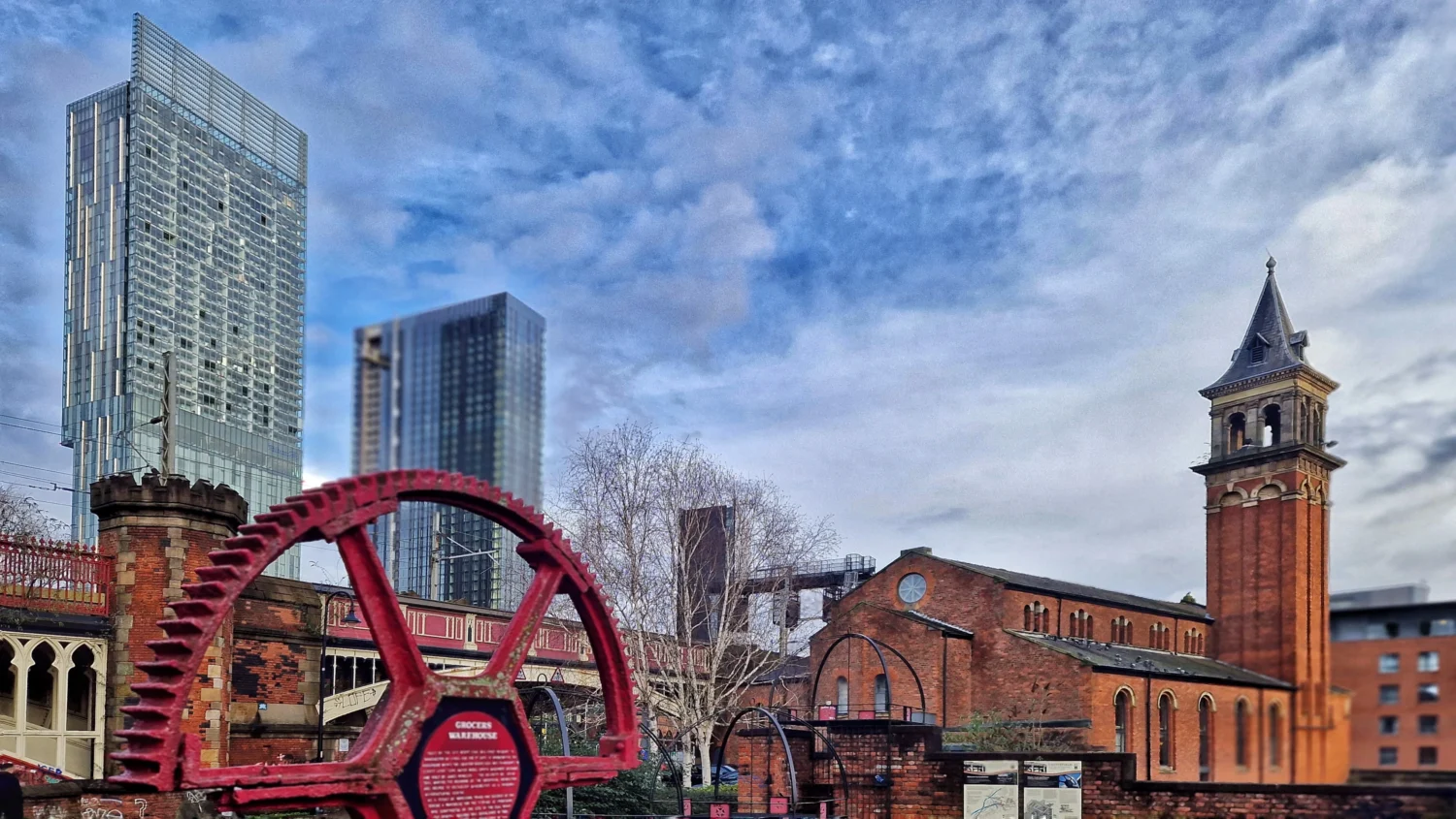 The canal at Castlefield with the Manchester skyline behind it