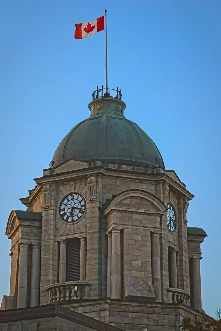 Copper dome of the old post office in Québec City with a Canadian flag